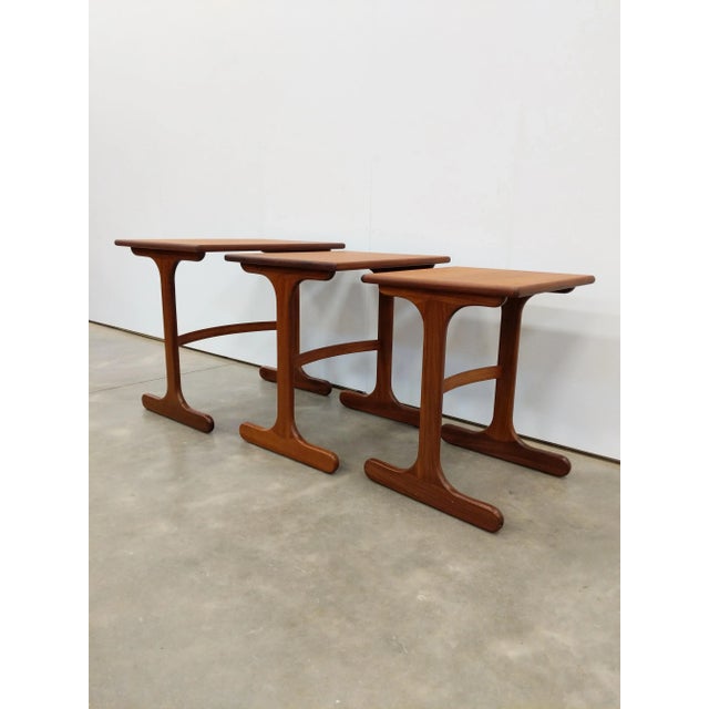 Set of 3 authentic vintage mid century modern teak nesting tables. By G Plan. Maker's label on bottom. This set is in...