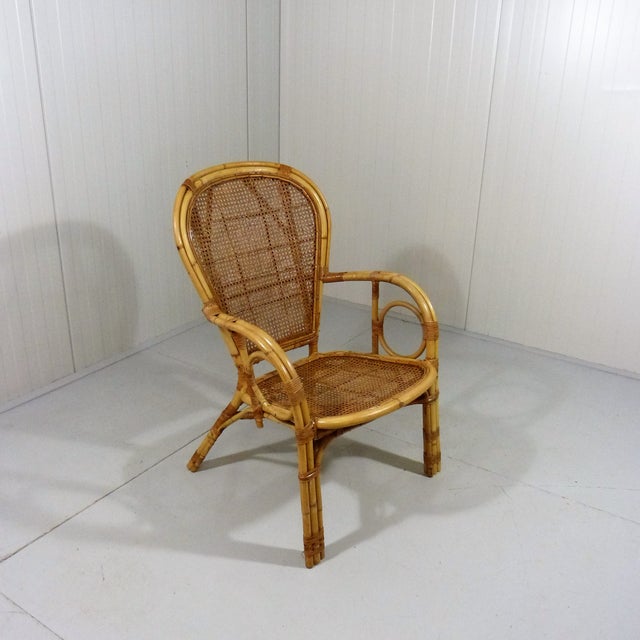 Italian rattan chair with braided seat and back rest. 1970’s. In good condition with light wear of use/age. H95,5 W65 D78...