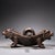 This is a finely crafted antique bronze herb grinder featuring a unique double tiger head design. The piece consists of a...