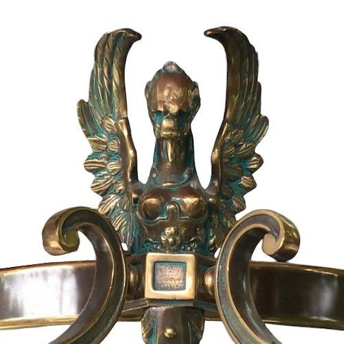 Griffins adorn the brass element, while the heavy glass diffuses the light perfectly. This is a dramatic yet tasteful...