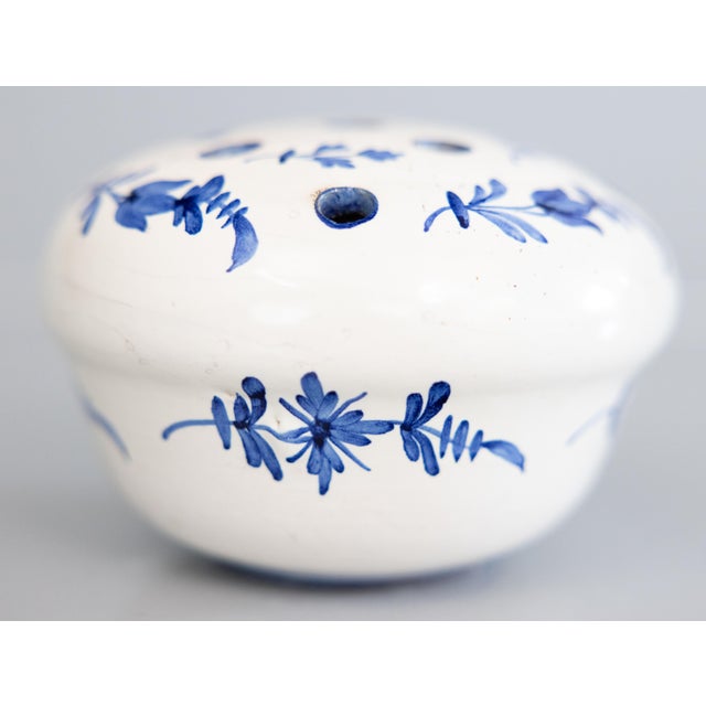 A fine antique French faience hand molded flower frog vase or rose bowl, circa 1900. This charming flower frog has a hand...