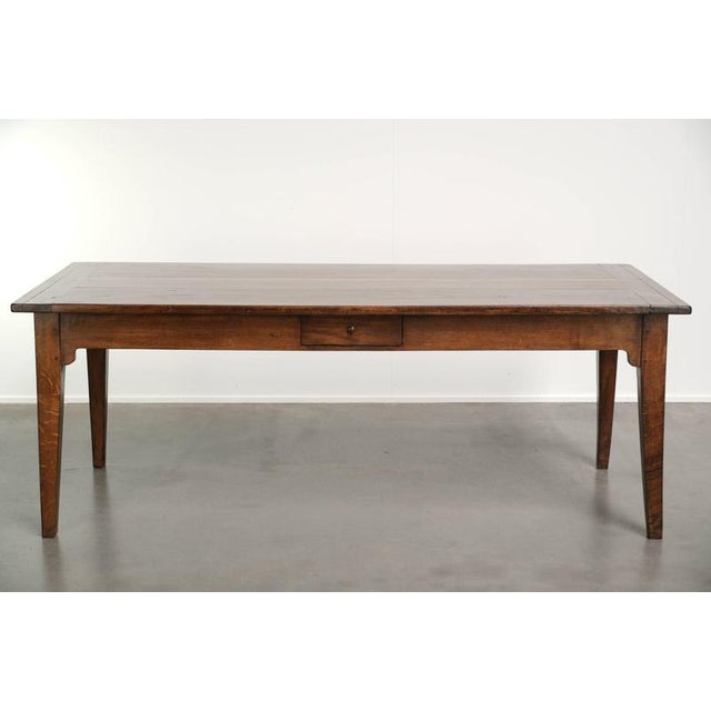 This beautiful antique French oak table dates from the early 19th century and has a luxurious rustic look. The table has a...