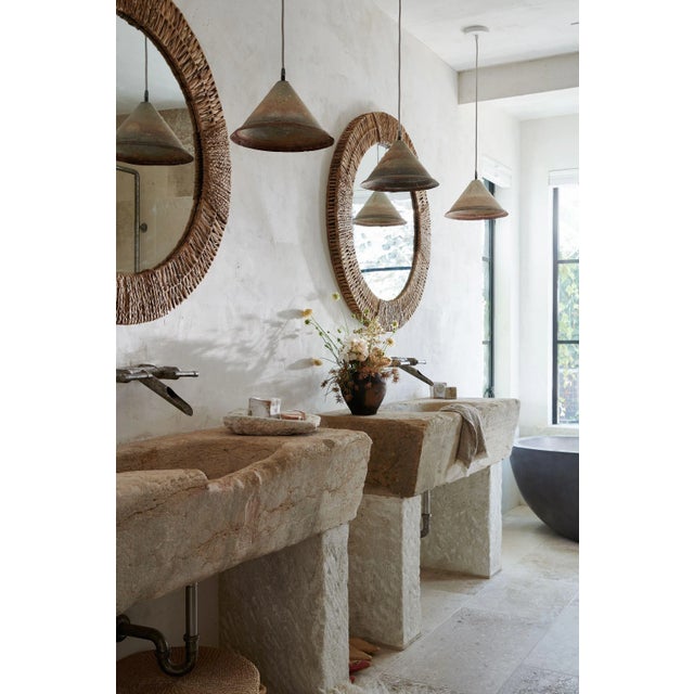 Earthy and organic, leaves of water hyacinth are woven with braided accents around this oversized mirror. The Folha makes...