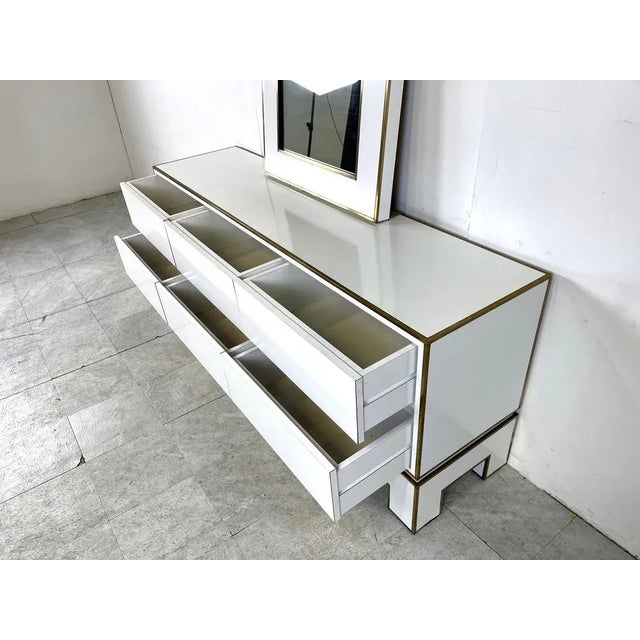 White Lacquered Credenza attributed to Alain Delon with Mirror, 1970s, in Good conditions. Designed 1970 to 1979 This...