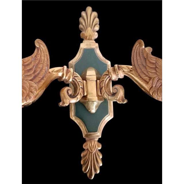 The wall sconces correspond to the swan model by Maison Lucien Gau, a Parisian bronze art manufacturer specializing in...