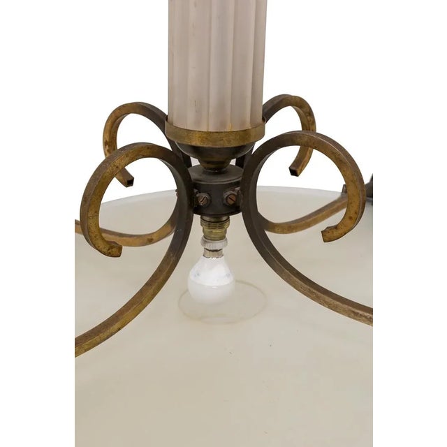 Great Art Deco ceiling lamp made of gilded bronze structure with glass. Three glass discs Diminishing give way to four...