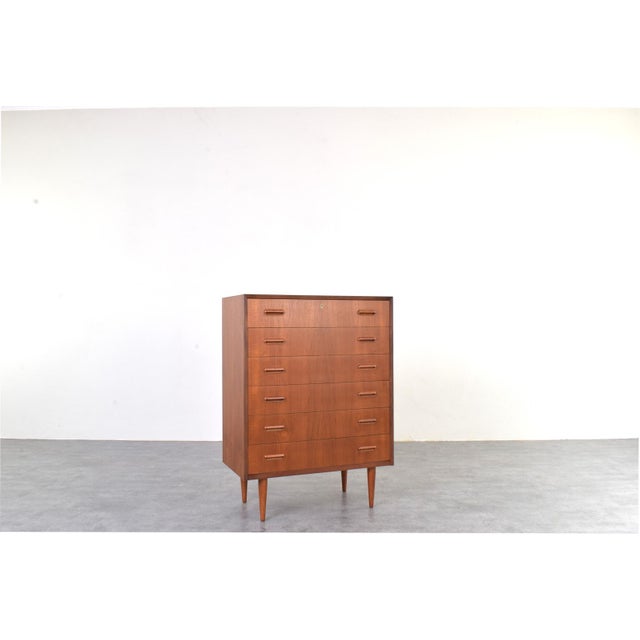 This Danish chest of drawers from the 1960s is an example of Mid-Century Modern design, which emphasized proportion,...