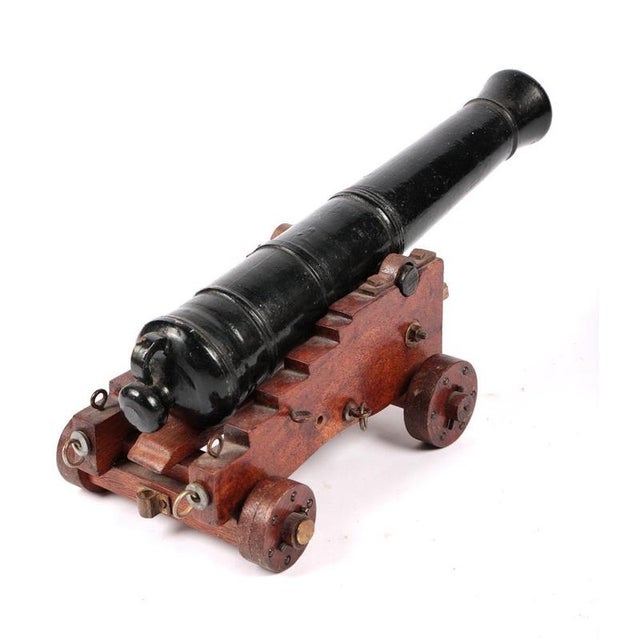 A fine antique Model Naval Deck Cannon (Victorian/Edwardian Era) Features a heavy brass or bronze barrel mounted on a...