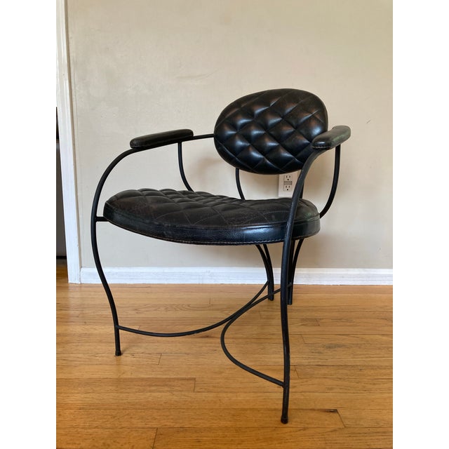 Uncommon maybe one-of-a-kind tufted leather and metal armchair. Bent metal is wrought iron hammer tone powder coated. This...