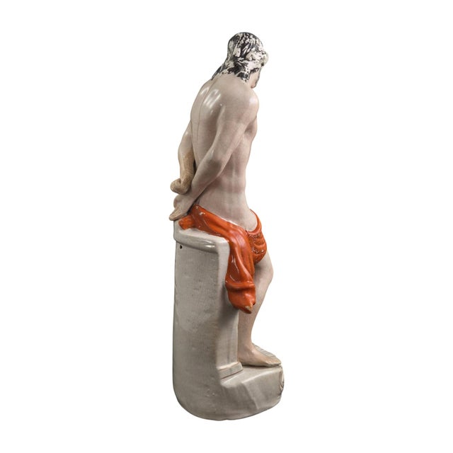 A large victorian staffordshire glazed earthenware figure depicting christ at the column, made in england circa 1860....