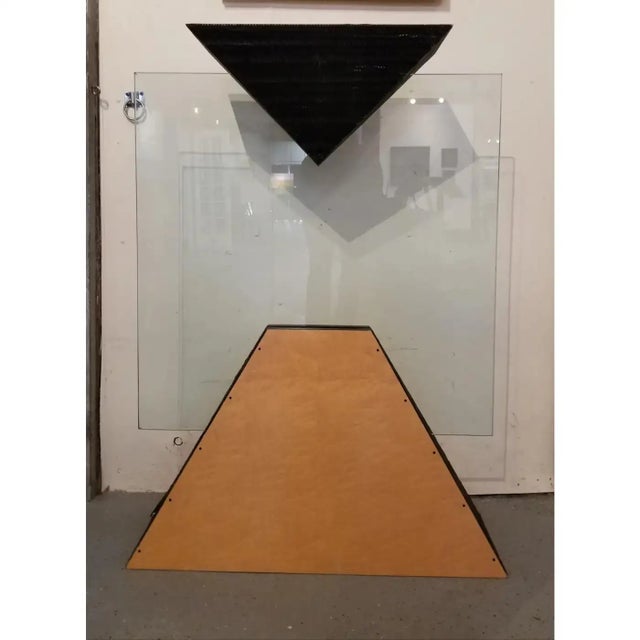 Charles B. Cobb California Studio geometric floor sculpture . Glass rectangular panel supported by two geometric, pyramid...