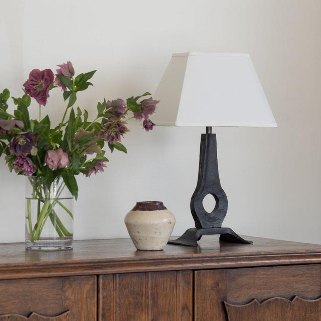 Beautiful brutalist iron table lamp from France, 1950s. Iron body with curved pedestal base and circle detail. Newly re-...