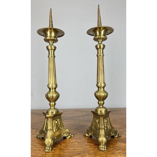 Elegant Vintage French Brass Candleholders This refined vintage French pair of brass candleholders displays classical...