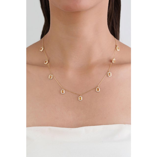 This elegant station necklace features 2.24 carats of natural citrine, set in 14K yellow gold. Each gemstones measuring 4...