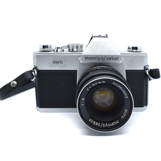 This vintage Mamiya/Sekor 500TL camera is a quintessential piece of mid-century industrial design, perfect for adding a...