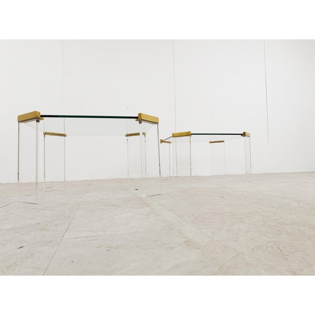 Acrylic Glass and Brass Coffee Tables, 1970s, Set of 2, in Good conditions. Designed 1970 to 1979