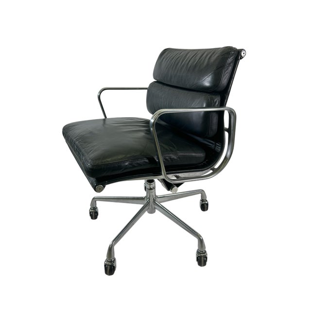 Designed by Ray and Charles and manufactured by Herman Miller, these Management Height Black Leather Soft Pad chairs...