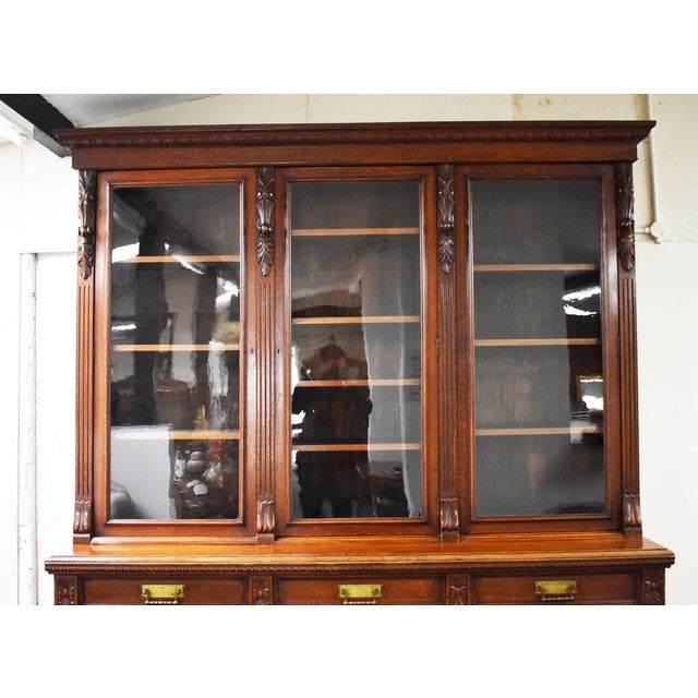 Victorian carved oak breakfront bookcase cabinet Item Code: RA4 A substantial and highly decorative Victorian carved oak...