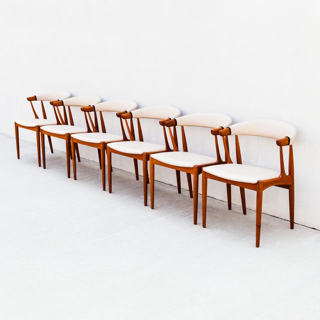 A phenomenal set of six Scandinavian mid century modern dining chairs in teak and Edelman leather by Johannes Andersen,...