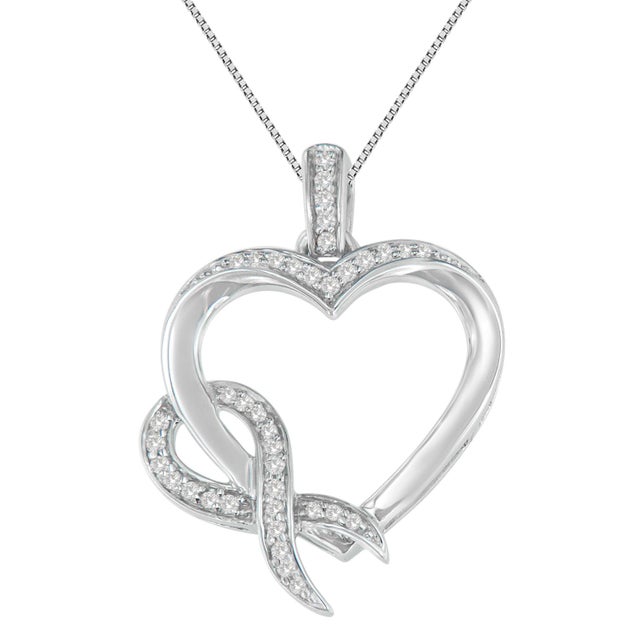 Delicately wrapped around a beautiful heart made up of round cut diamonds, is a single ribbon, which only adds to the...