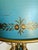 This vintage French Empire Revival bouillotte lamp features a beautifully painted blue tole shade, warm brass hardware,...