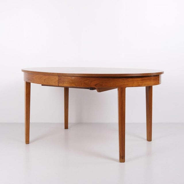 Oval dining table made in Danish design in the 1960s. Crafted in rosewood with pronounced grain. The table features...