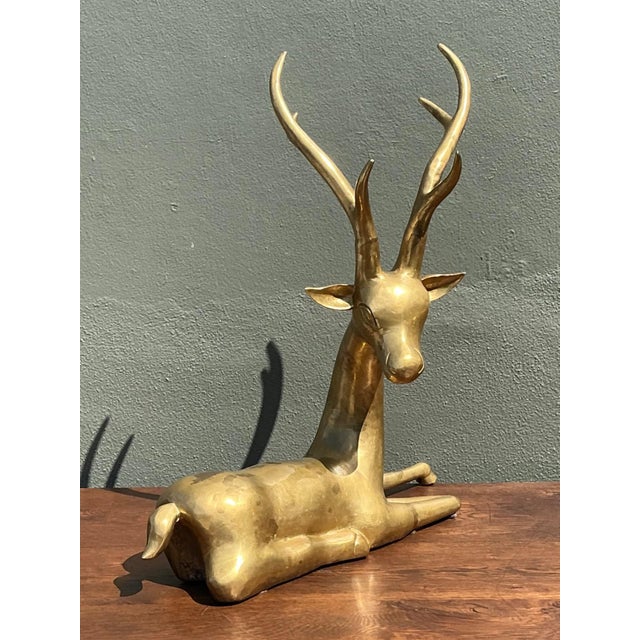 Graceful and timeless, this vintage solid brass deer sculpture beautifully captures the quiet elegance of wildlife through...