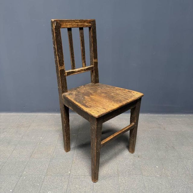Old, worn-out farmhouse chair from the early 1900s. The chair has a beautiful, simple look. We cleaned it and gave it a...