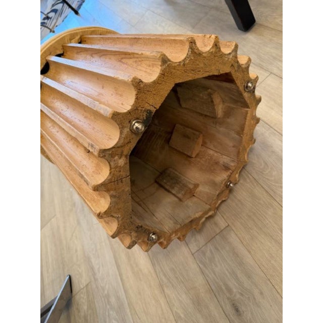 This is a pair of ottomans on casters with a fluted wood base and an upholstered top in a faux bois fabric. These look to...