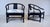 An impressive pair of solid Ebony Mid 20th Century Chinoiserie lounge chairs with distinct specs and influences pre-...