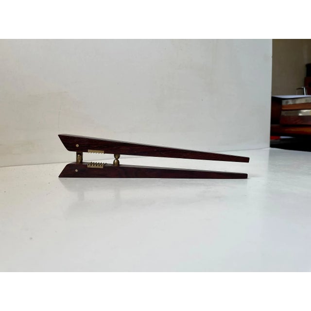 A simple design dating back to the early 1960’s, this poul knudsen rosewood and brass nutcracker utilizes two pieces of...