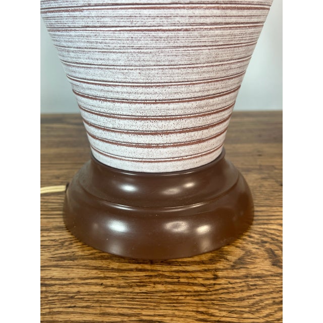 For sale is this stunning pair of two large table lamps that are made out of ceramic with metal bases.