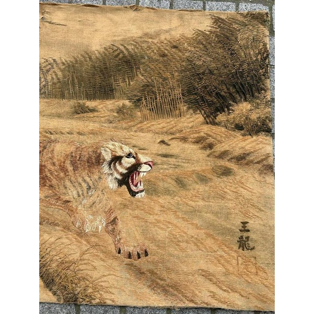 Nice antique Japanese embroidery with beautiful design with tigers, and with nice natural colours in hues of yellow,...