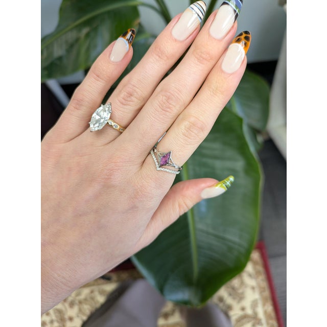 Crafted in solid 14K gold, this chevron band sparkles with natural diamonds set in a sleek V silhouette. The pave-style...