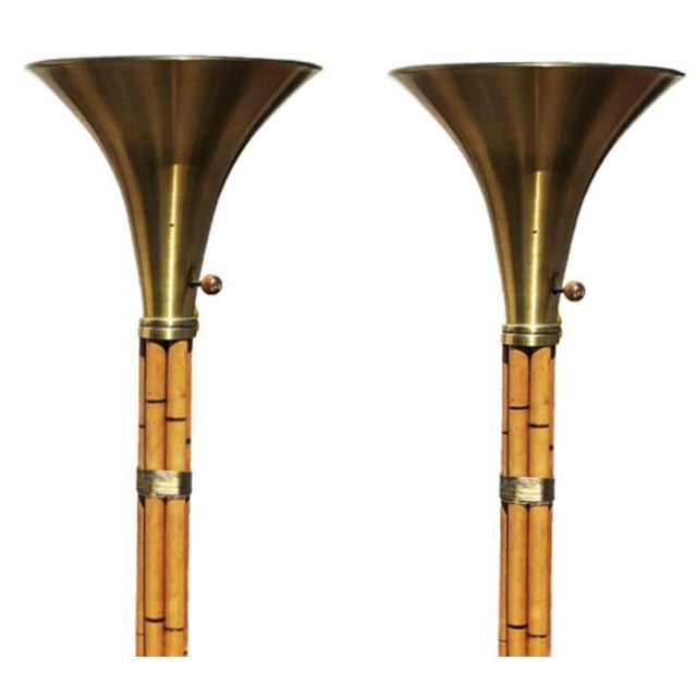 vRestored Russel Wright Designed Brass and Rattan Mid-century torchère floor lamps. Crafted with 6 stacked rattan poles...