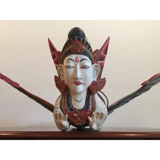 This Indonesian Flying Garuda Figure is hand carved with beautifully detailed painting in the traditional Balinese style...