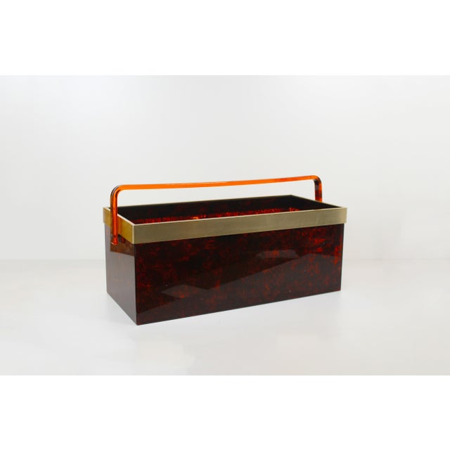 Decorative and exceptionally large magazine rack in 'faux tortoiseshell' with brass finish. Very large model with a length...