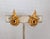 Early 1960s modernist goldtone loop with smooth inside and textured outside clip earrings. Marked "©BOUCHER" with...