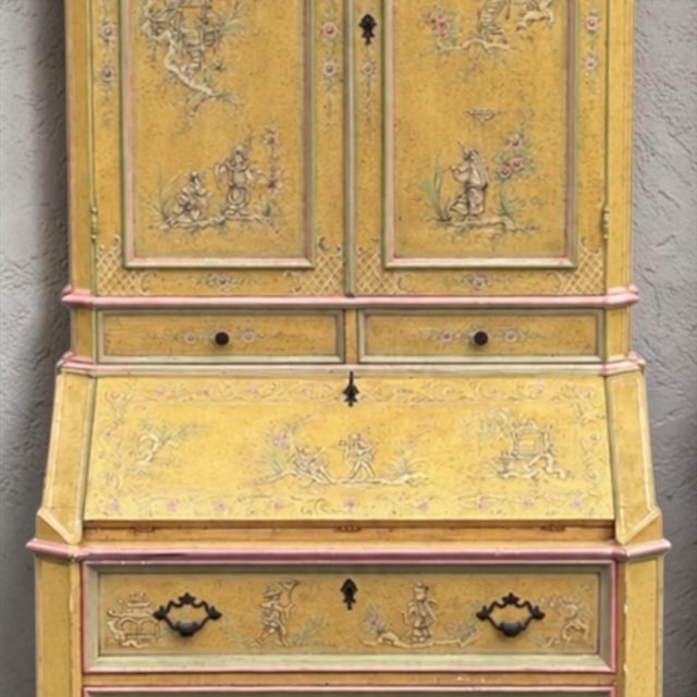 This is a mid-century Italian hand painted chinoiserie secretary desk. It is a base color of ochre and accents of pink and...