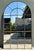 Vintage Monumental Arched Wrought Iron Mirror With Patinated Mullion Detail For Sale - Image 12 of 12