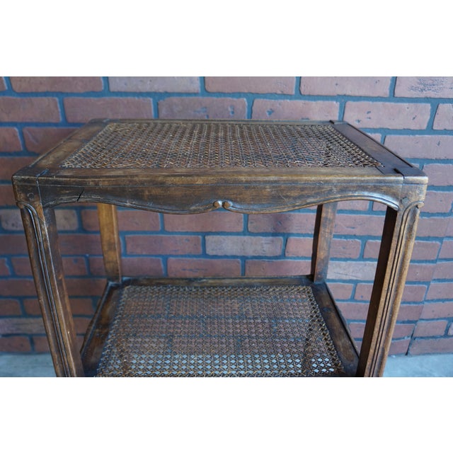 Charming petite antique French side table. Finely crafted of walnut with sweet carved details and delicate cabriole legs....