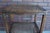 Charming petite antique French side table. Finely crafted of walnut with sweet carved details and delicate cabriole legs....