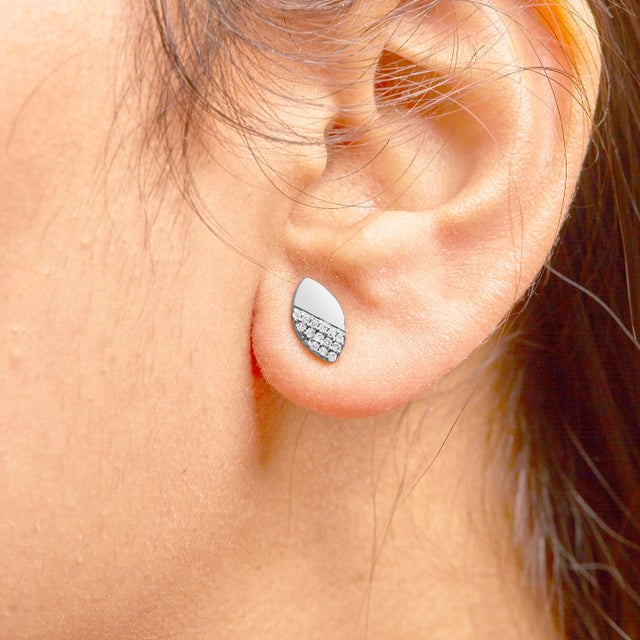 Crafted with the utmost precision, these elegant earrings blend timeless glamour with contemporary design. Made from...