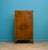 Compact walnut linen cabinet with a drawer over double doors. Inside are fixed shelves for practical storage. The drawer...