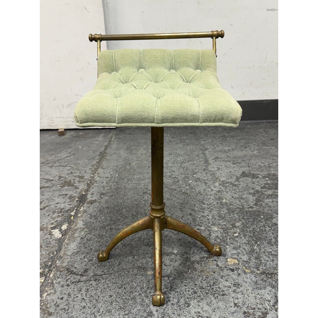 Design Plus Gallery presents a 1940s French Brass Stool. This vintage stool pairs a brass pedestal frame with a pale green...
