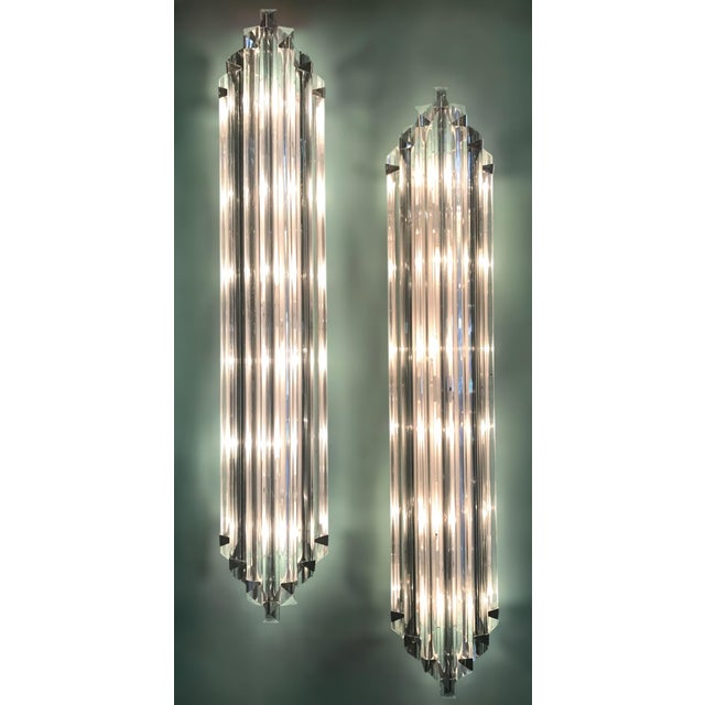 Italian wall light with clear crystals individually hand blown with smoky stripes and cut to three points in Triedri...