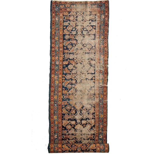 Name:WORN Navy and Turmeric Heriz Runner in Water Garden Design Size: 2.9 x 12.8 Age: Antique, C. 1920-30 Pile: Low/Medium...
