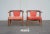 Stunning pair of mid century horseshoe lounge chairs with original pink/red velveteen-like upholstery. This is one of the...