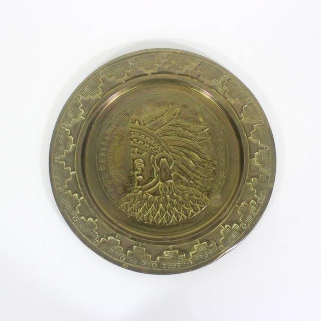 Vintage brass plate with a detailed Mayan Aztec man and geometric detail. This has been meticulously hand tooled and...