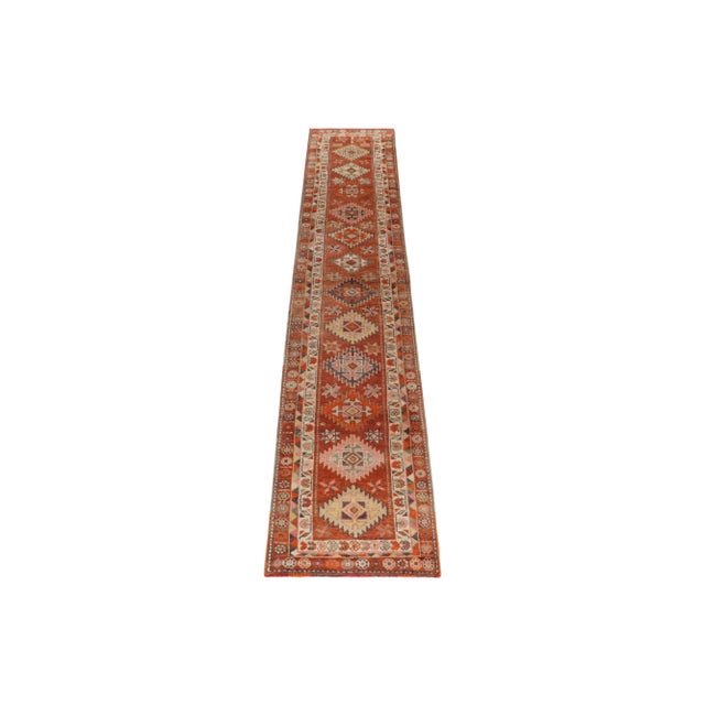 Hand-knotted in wool, a 3x16 vintage runner from Rug & Kilim’s latest curation of rare tribal pieces. Originating from...